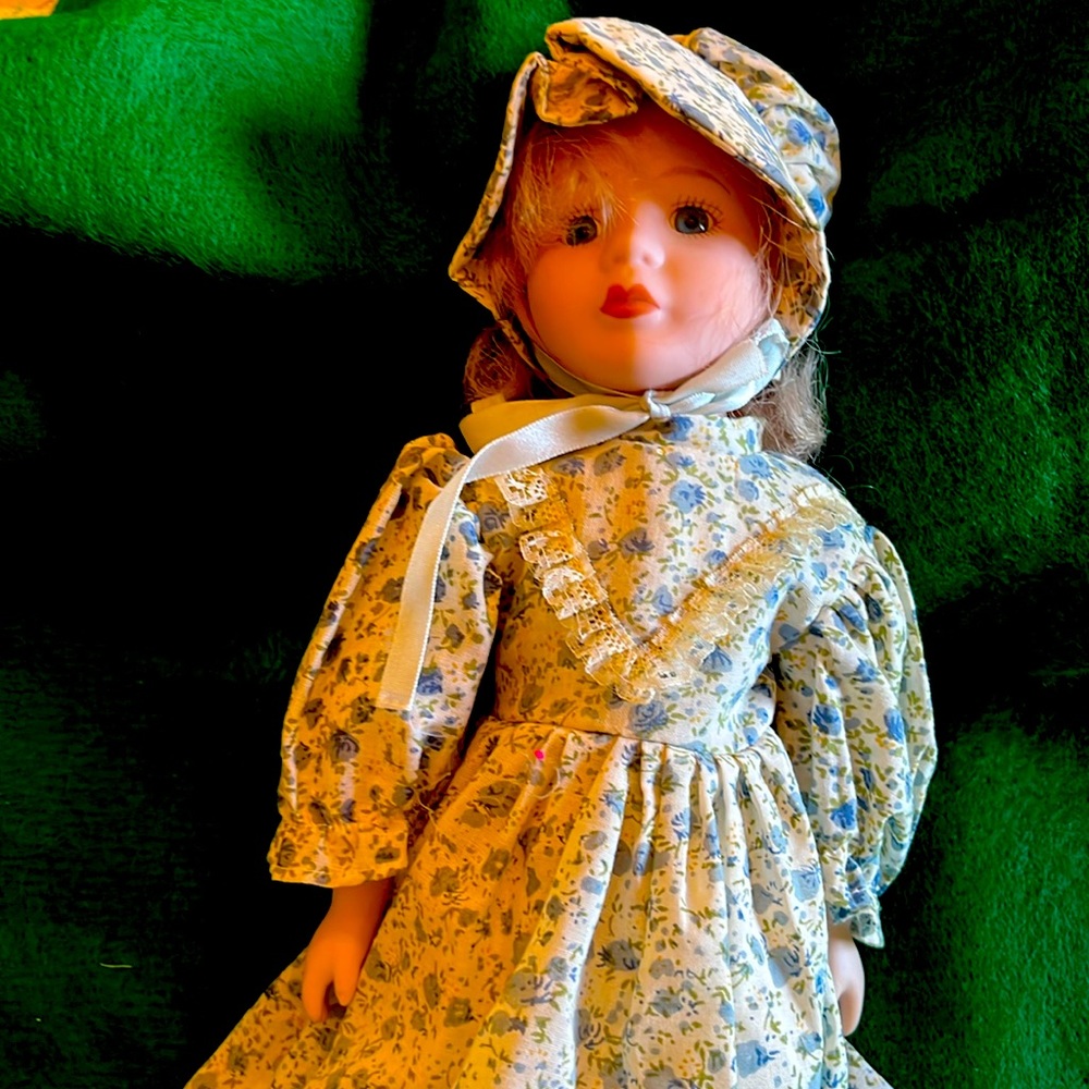 Vintage doll with porcelain hands and face